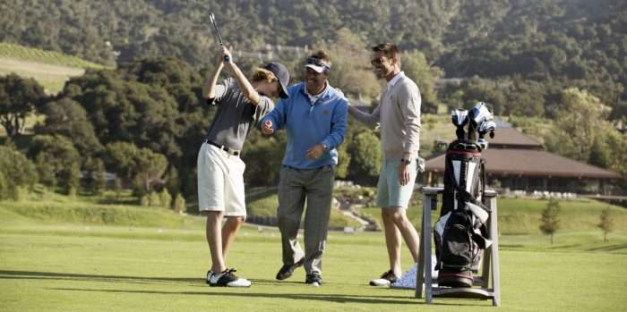 Guys on golf course having fun
