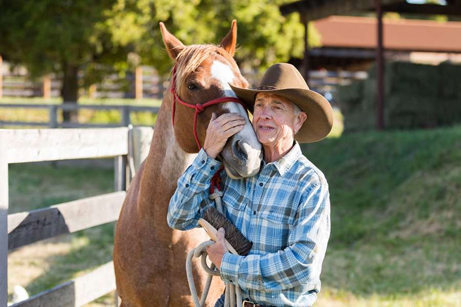 Ranch hand with horse